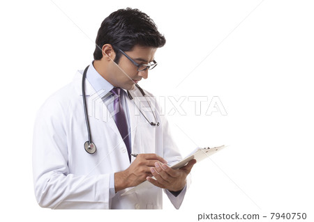 Male doctor writing on clipboard over white background 7940750