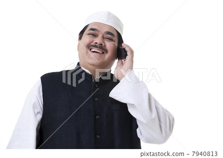 Male politician talking on a mobile phone 7940813