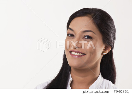 Beautiful mid adult woman smiling over white background 7940861