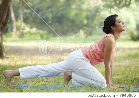 Young woman in lawn stretching 7940866