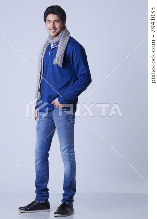 Portrait of handsome young man with hands in pockets 7941033