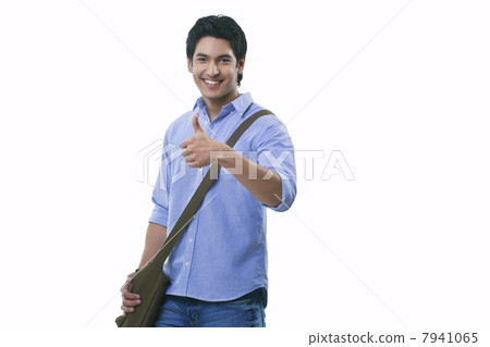 College student showing thumbs up sign 7941065