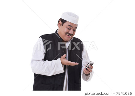 Happy politician gesturing while reading text message 7941086