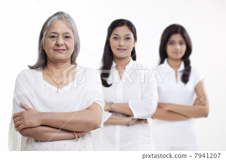 Portrait of multi generation family standing over white background 7941207