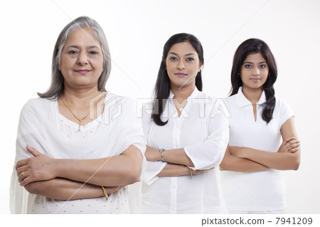 Portrait of multi generation family smiling over white background 7941209