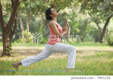 Active young woman practicing yoga 7941220