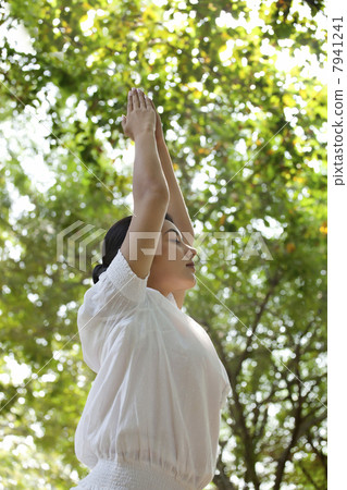 Low angle view of woman doing yoga 7941241
