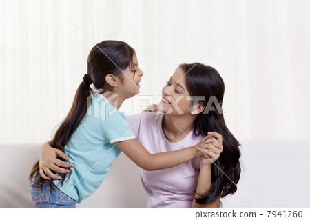 Happy mother and daughter dancing 7941260