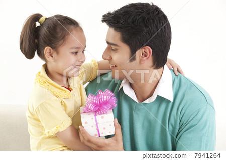 Father giving gift to his daughter 7941264