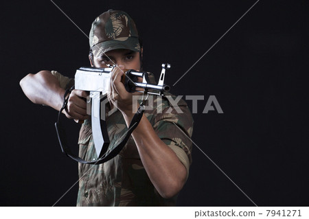 Young army man aiming with a rifle 7941271