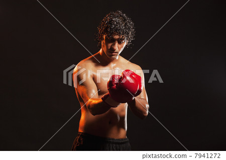 Young male boxer wearing gloves 7941272