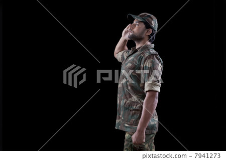 Male military soldier saluting over black background 7941273