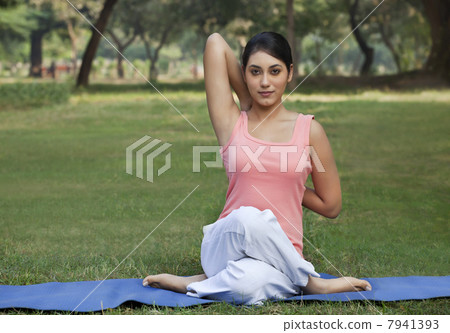 Woman stretching her arms in a yoga Woman stretching her arms in a yoga 7941393