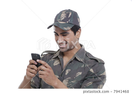 Happy soldier text messaging 7941468