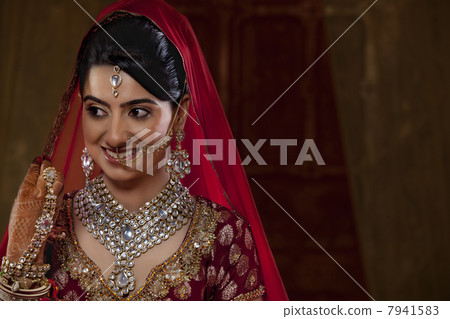Smiling bride looking away 7941583
