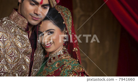 Portrait of bride resting her head on mans shoulder Portrait of bride resting her head on mans shoulder 7941660