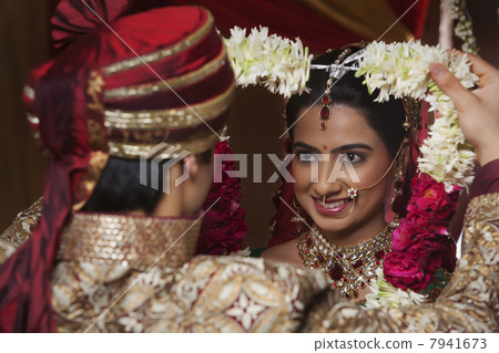 Close-up of bride and groom during wedding ceremony Close-up of bride and groom during wedding ceremony 7941673