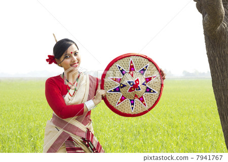 Portrait of Bihu woman holding a jaapi 7941767