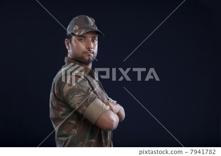 Young handsome soldier with arms folded 7941782
