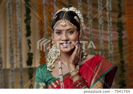 Portrait of happy young woman on her wedding day 7941784