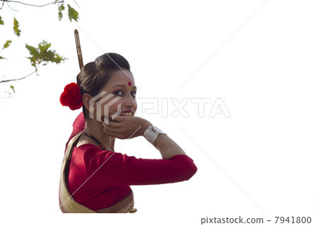 Portrait of woman doing Bihu dance Portrait of woman doing Bihu dance 7941800