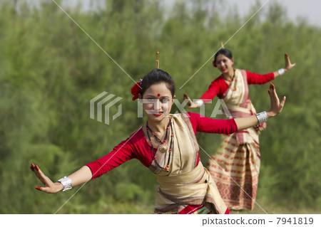 Women performing Bihu dance 7941819