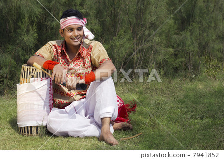 Bihu dancer sitting with a dhol Bihu dancer sitting with a dhol 7941852