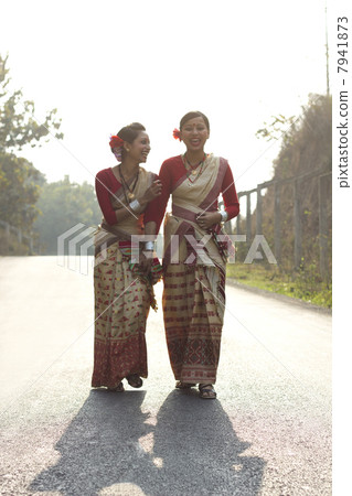Bihu dancers sharing a laugh 7941873