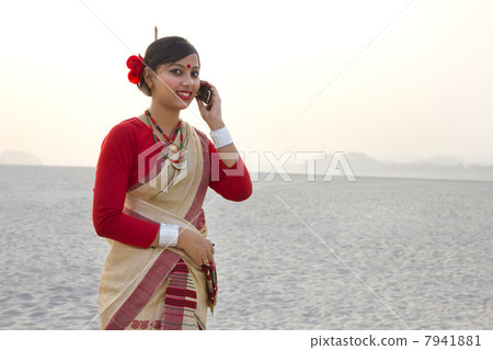 Bihu woman talking on a mobile phone Bihu woman talking on a mobile phone 7941881