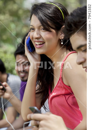Group of young friends using mobile phone 7941882