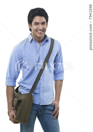 Young handsome man standing over white background 7941896