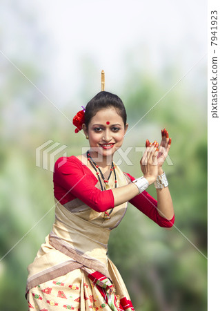 Woman performing Bihu dance Woman performing Bihu dance 7941923