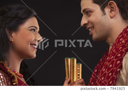 Couple with sticks 7941925