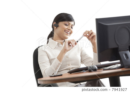 Female professional on call with desktop 7941927