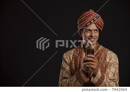 Gujarati groom with a mobile phone 7942004