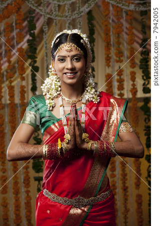 Portrait of woman with hands clasped 7942005