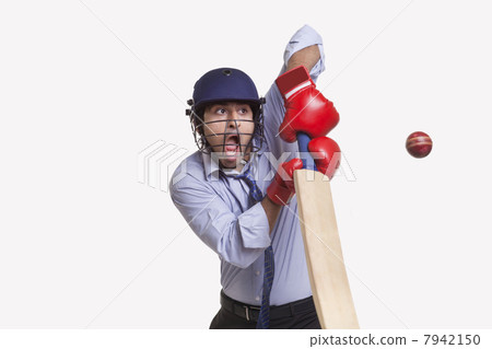 Young businessman hitting ball 7942150