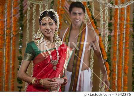 Portrait of smiling young couple on their wedding day Portrait of smiling young couple on their wedding day 7942276