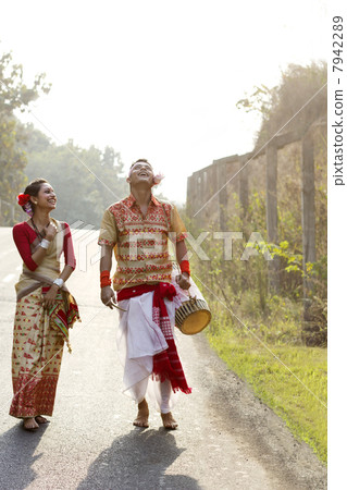 Bihu dancers walking together and laughing 7942289