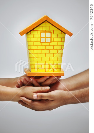 Hands holding model house Hands holding model house 7942346