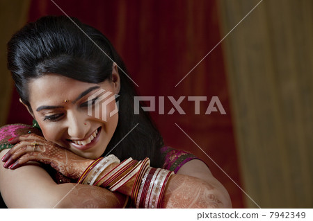 Close-up of happy young bride looking down Close-up of happy young bride looking down 7942349