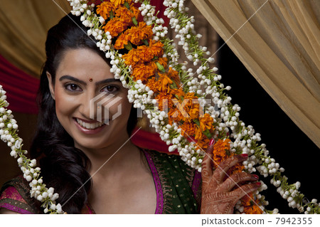 Close-up portrait of smiling young Indian bride 7942355