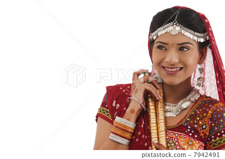 Female dandiya dancer with sticks Female dandiya dancer with sticks 7942491