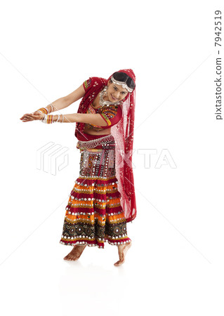 Female dandiya dancer dancing 7942519