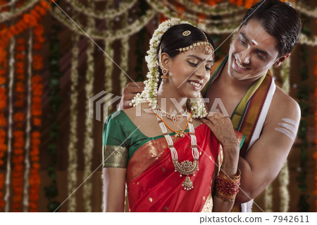 Man fastening necklace on woman Man fastening necklace on woman 7942611