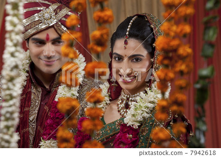 Portrait of an attractive newlywed couple smiling 7942618