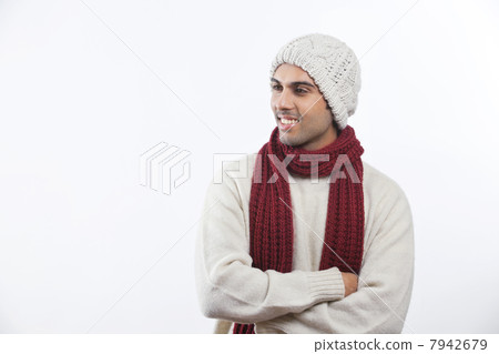 Happy young man with arms crossed standing over white background Happy young man with arms crossed standing over white background 7942679
