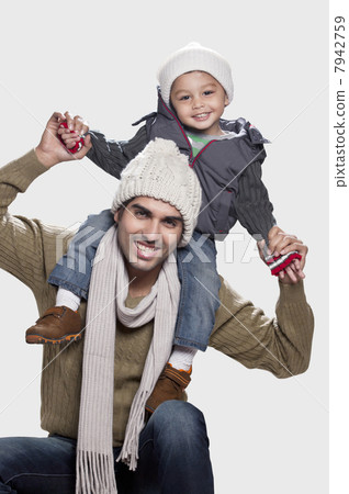 Son and father in playful mood white background 7942759