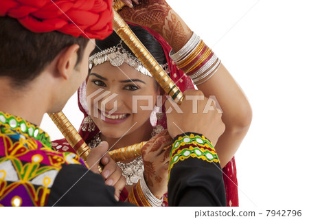 Couple with sticks dancing Couple with sticks dancing 7942796