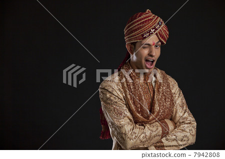 Portrait of a Gujarati groom winking 7942808